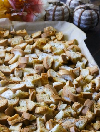 gluten-free croutons on a cookie sheet lined with parchment paper